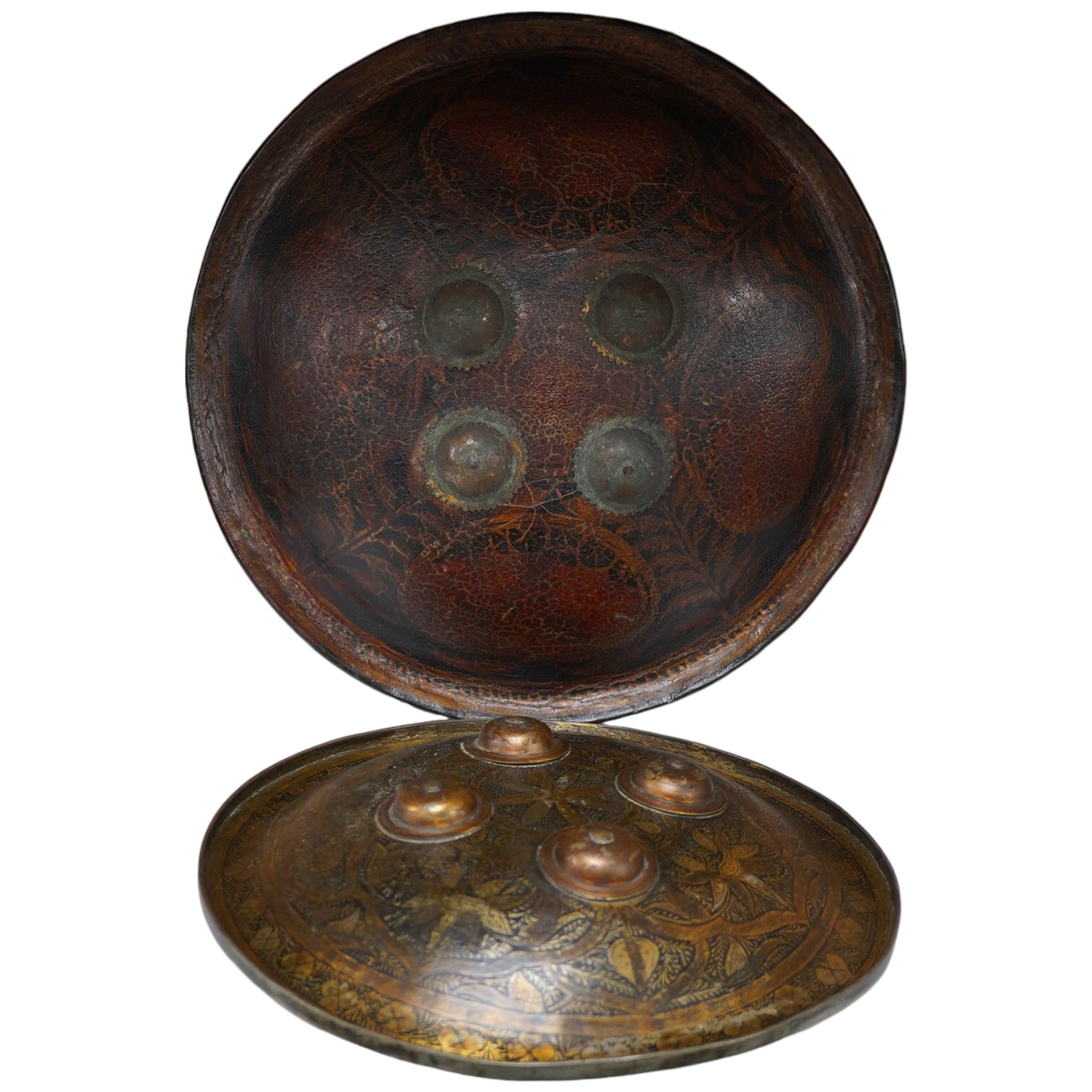 Two Persian style shields, one papier mache the other metal, largest 34cm diameter. Condition - good